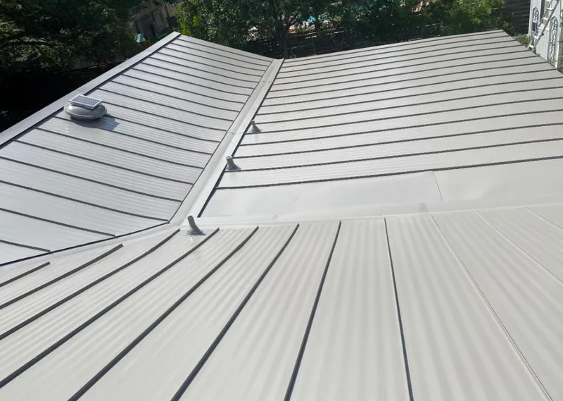 Solar attic fan installed on a metal roof for Roof Ventilation in Collingswood